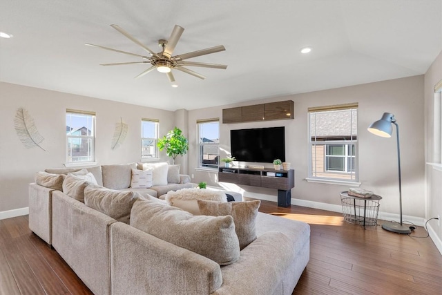 living room featuring ceiling fan, dark hardwood / wood-style flooring, and lofted ceiling