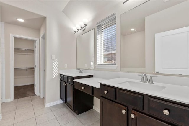 bathroom with tile patterned flooring and vanity