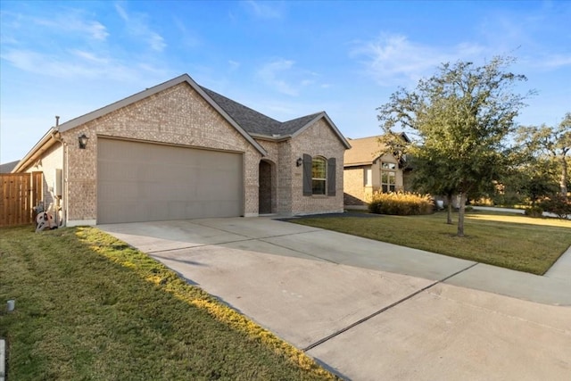 view of front of home featuring a front lawn and a garage