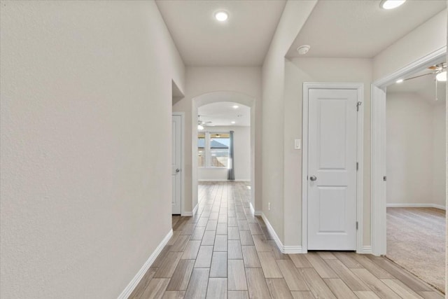 hallway with light wood-type flooring