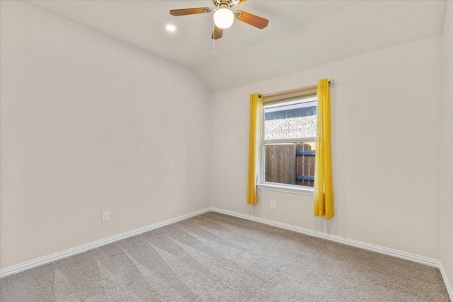 unfurnished room with ceiling fan, carpet, and lofted ceiling