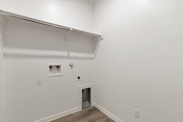 laundry area with electric dryer hookup, hookup for a gas dryer, wood-type flooring, and hookup for a washing machine