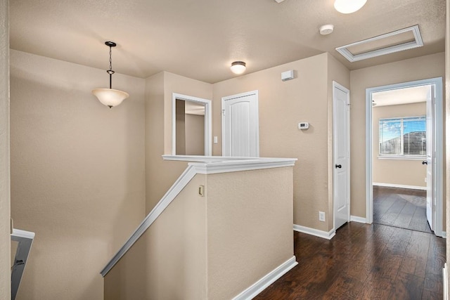 hall with dark hardwood / wood-style floors