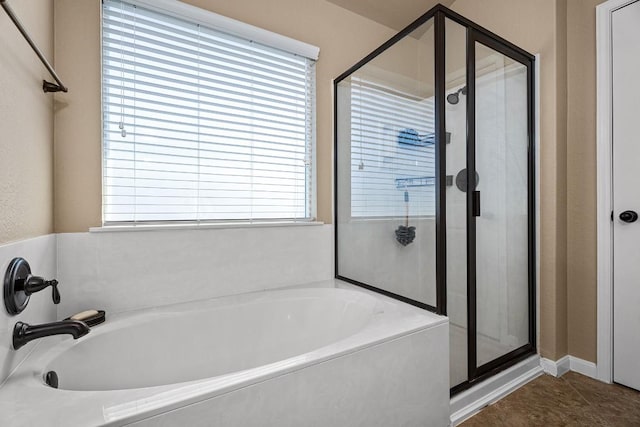 bathroom with tile patterned floors, plenty of natural light, and independent shower and bath