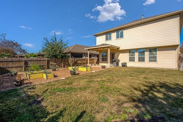 rear view of house with a yard