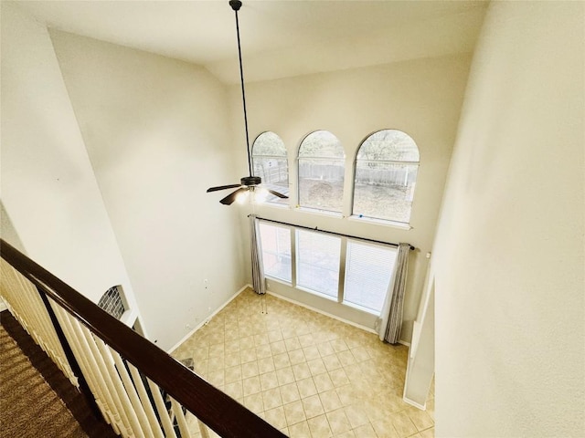 interior space with high vaulted ceiling and ceiling fan