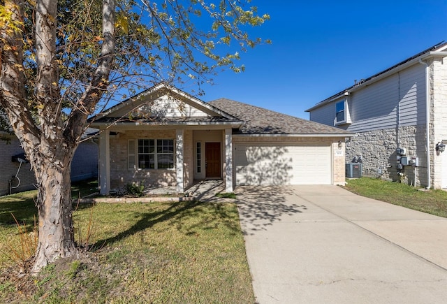 view of front of home featuring a garage and a front yard