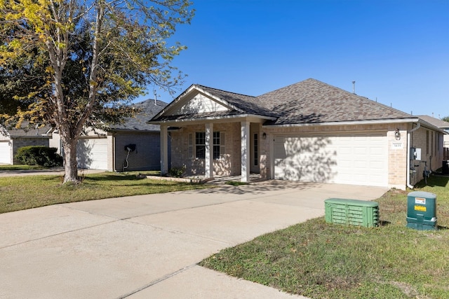 view of front of home with a garage, covered porch, and a front yard