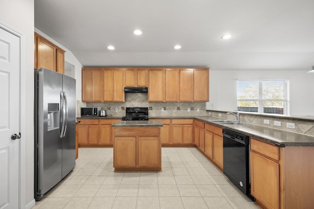 kitchen with decorative backsplash, sink, black appliances, a center island, and light tile patterned flooring