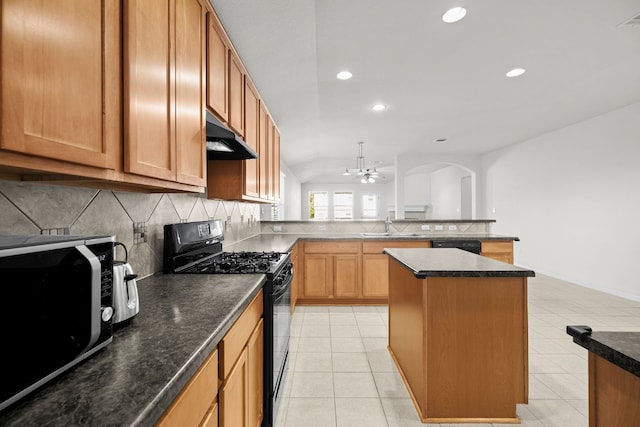 kitchen featuring a center island, black appliances, sink, ceiling fan, and light tile patterned floors