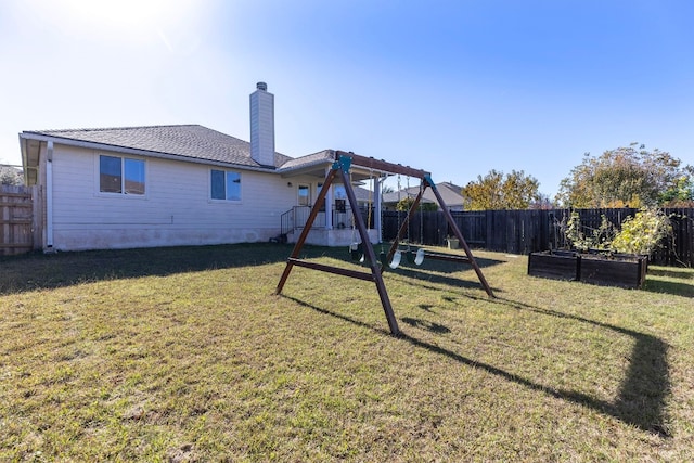 exterior space with a yard and a playground