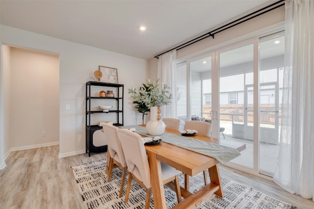 dining area with light hardwood / wood-style flooring