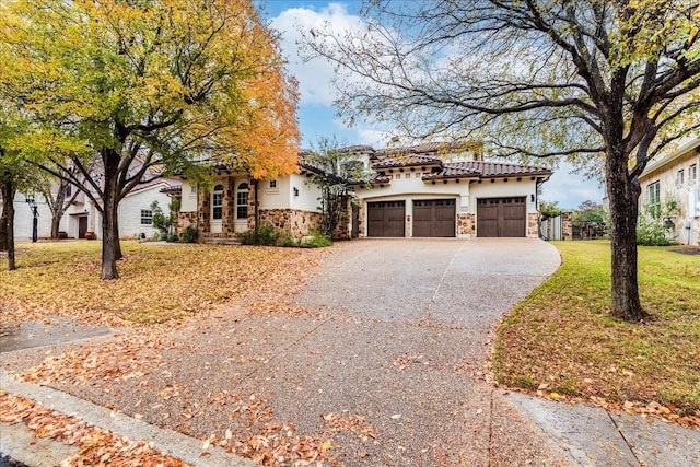 view of front facade with a garage and a front yard