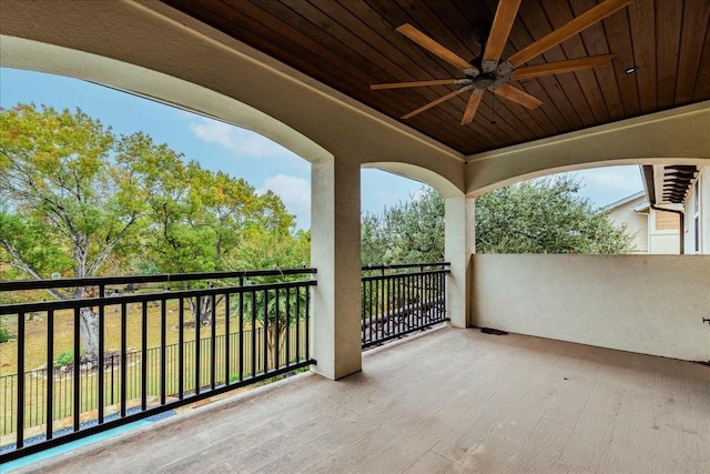 view of patio / terrace with a balcony and ceiling fan