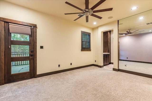 carpeted empty room with ceiling fan