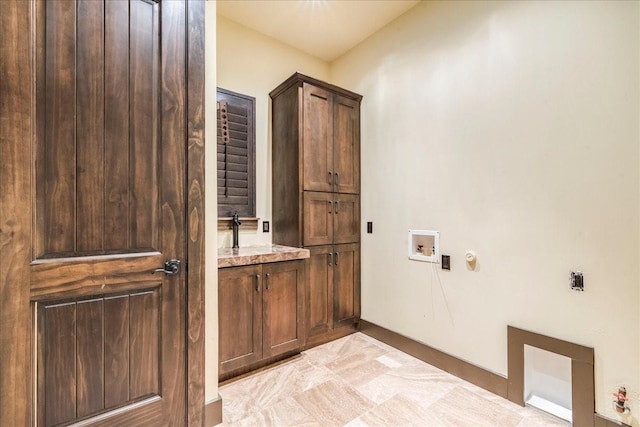 laundry room with cabinets and hookup for a washing machine