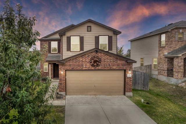 360 Gina Dr, Kyle, TX 78640 - traditional-style house featuring brick siding, concrete driveway, and a garage