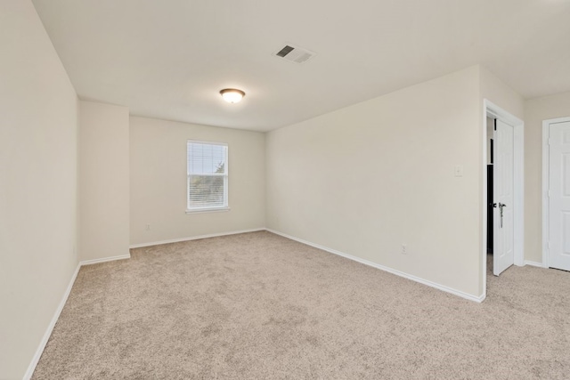 empty room with light colored carpet