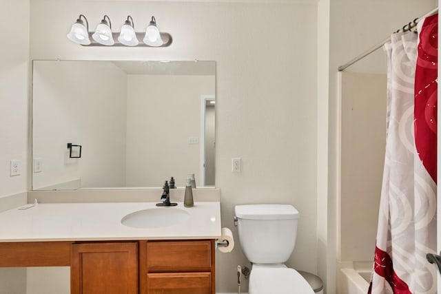 full bathroom featuring vanity, shower / bath combination with curtain, and toilet