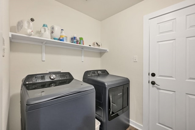 360 Gina Dr, Kyle, TX 78640 - washroom with washer and clothes dryer and baseboards