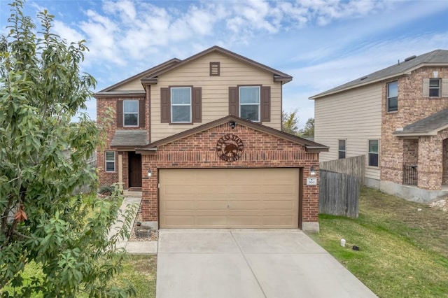 360 Gina Dr, Kyle, TX 78640 - traditional home featuring brick siding, driveway, and a garage