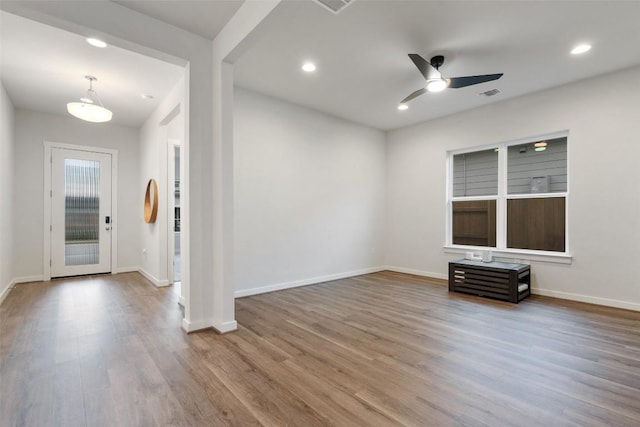 interior space featuring ceiling fan and hardwood / wood-style flooring