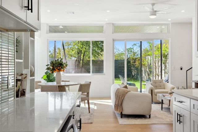 sunroom featuring ceiling fan