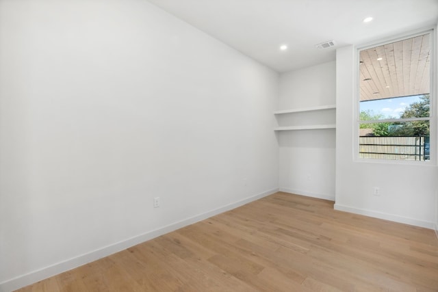 unfurnished room with light hardwood / wood-style floors