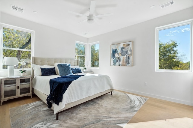 bedroom featuring hardwood / wood-style flooring and ceiling fan