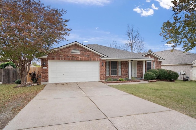 ranch-style home with a garage and a front lawn