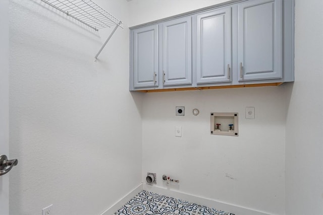 clothes washing area featuring electric dryer hookup, hookup for a gas dryer, hookup for a washing machine, and cabinets