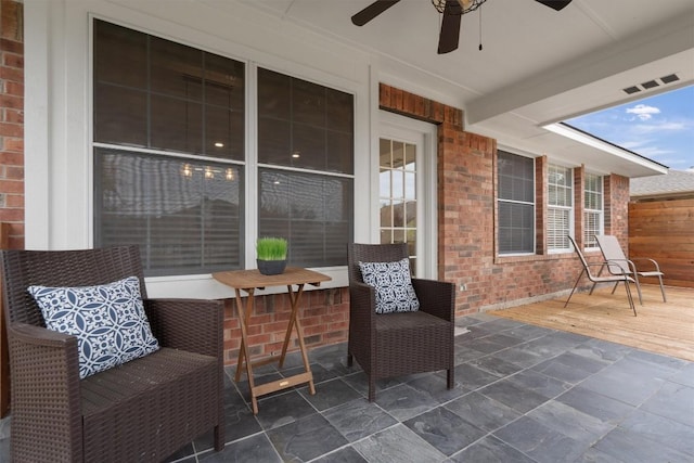 view of patio featuring ceiling fan