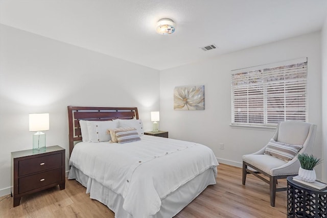 bedroom featuring light hardwood / wood-style floors