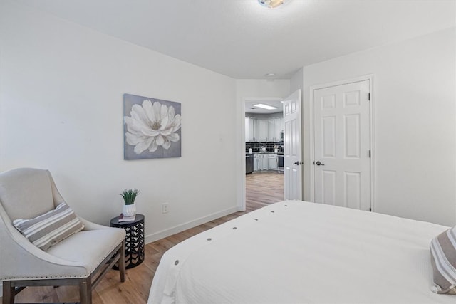 bedroom featuring hardwood / wood-style floors