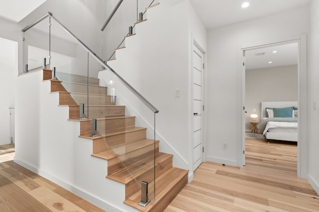 staircase featuring hardwood / wood-style flooring