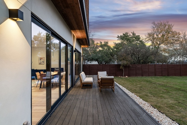 deck at dusk with a yard