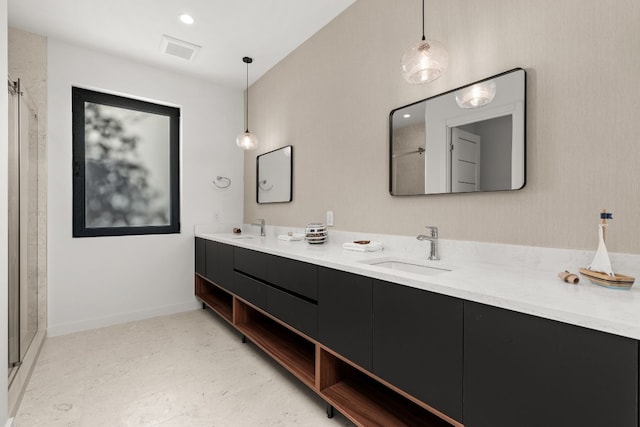 bathroom with vanity and an enclosed shower