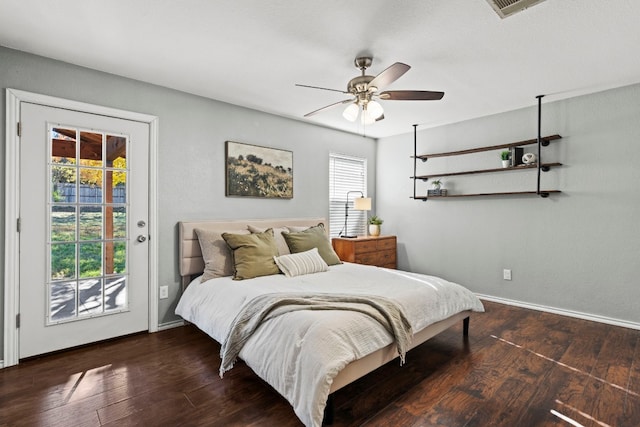 bedroom featuring access to outside, ceiling fan, and dark hardwood / wood-style floors