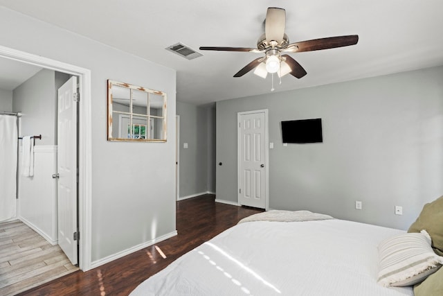 bedroom with ceiling fan and dark wood-type flooring