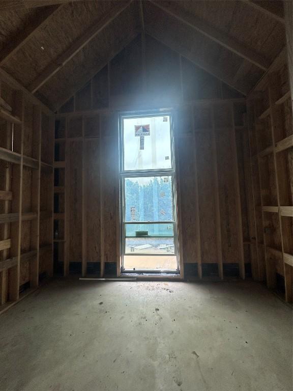 miscellaneous room featuring high vaulted ceiling