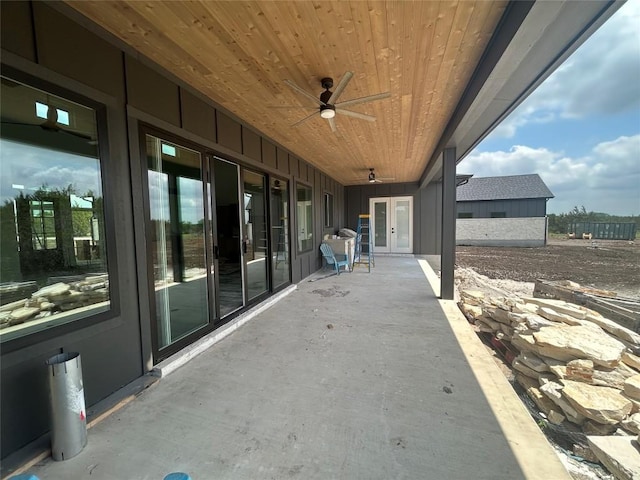 view of patio with ceiling fan and french doors