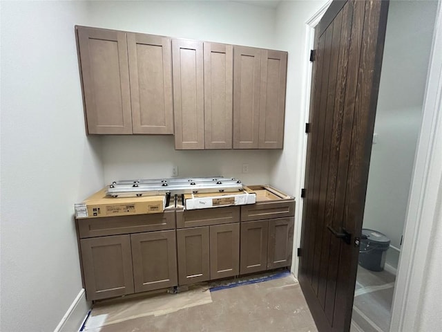 washroom featuring baseboards