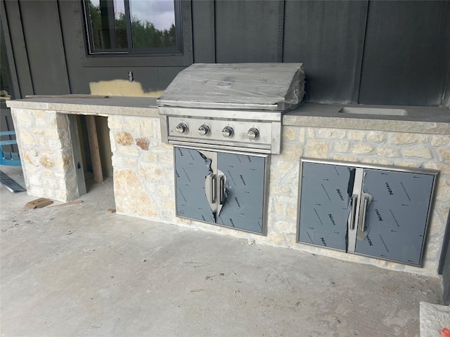 view of patio with exterior kitchen
