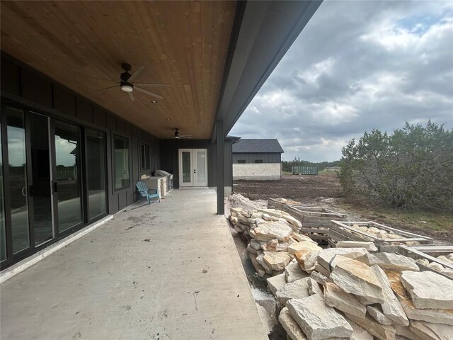 view of patio / terrace with a ceiling fan and french doors