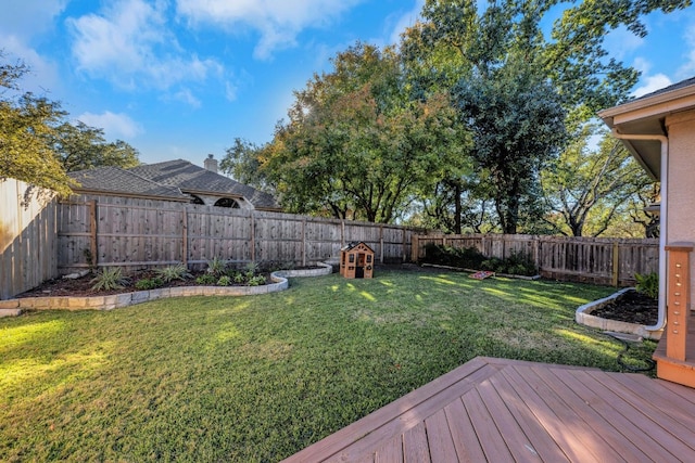 view of yard with a wooden deck