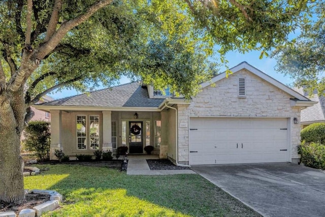 single story home with a garage and a front yard