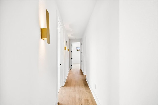 hall with light hardwood / wood-style floors