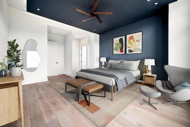 bedroom featuring ceiling fan and hardwood / wood-style flooring