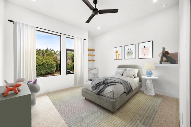 bedroom with ceiling fan and light colored carpet