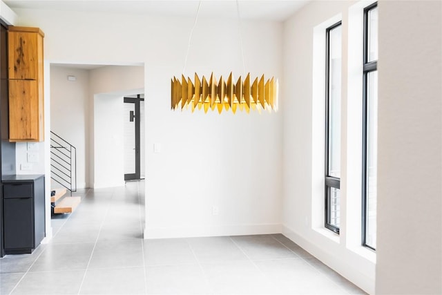 hallway featuring light tile patterned flooring